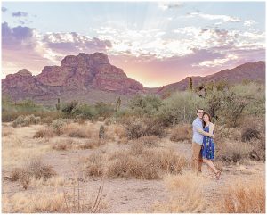 Red Mountain Sunset with engaged man and woman hugging for the Phoenix Wedding Photographer