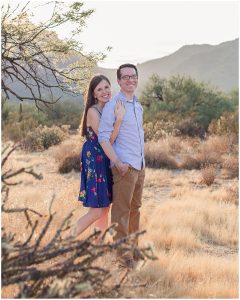 Phoenix Wedding Photographer photographs Engaged Man and woman embracing in front of Red Mountain Mesa Arizona